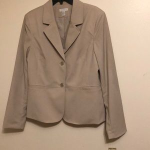 Tan jacket, mix of polyester, rayon and spandex. . Fully lined.